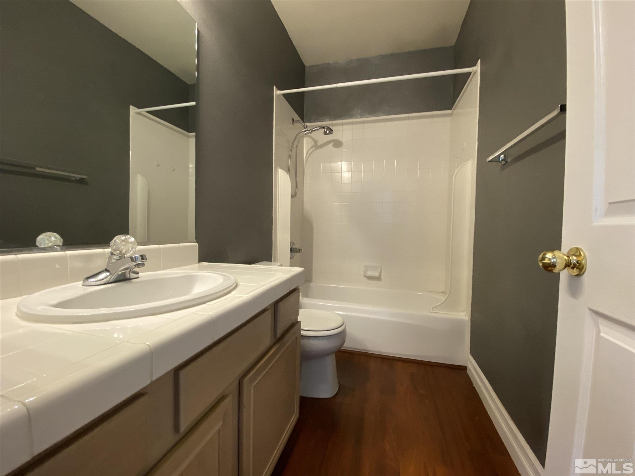 9636 Truckee Meadows Place Reno, NV 89521 - Photo 18 of 21 a bathroom with a sink a toilet and shower