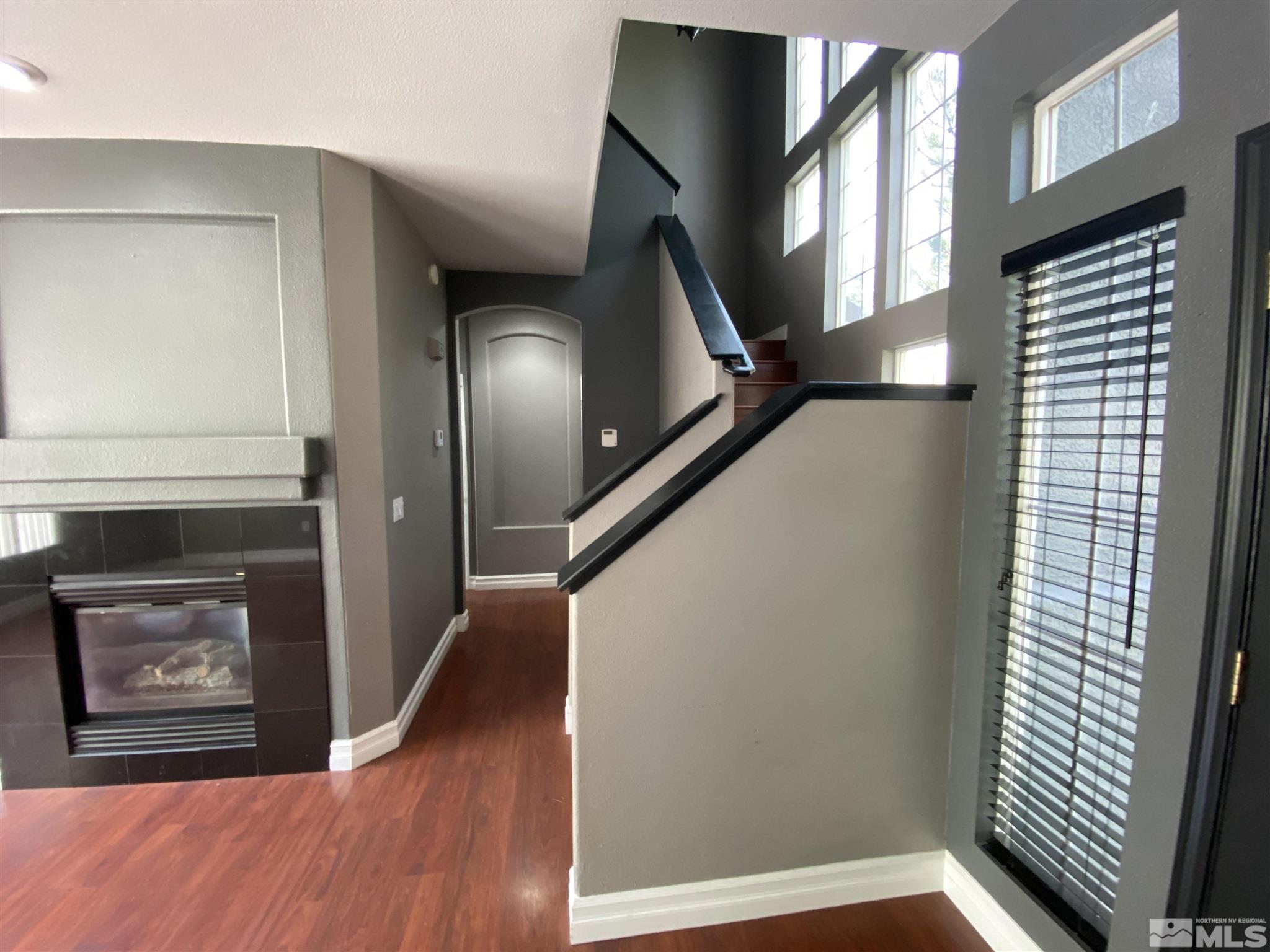 9636 Truckee Meadows Place Reno, NV 89521 - Photo 7 of 21 a view of an entryway with wooden floor