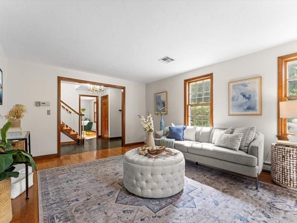 769 Edgell Road Framingham, MA 01701 - Photo 3 of 37 a living room with furniture and a wooden floor