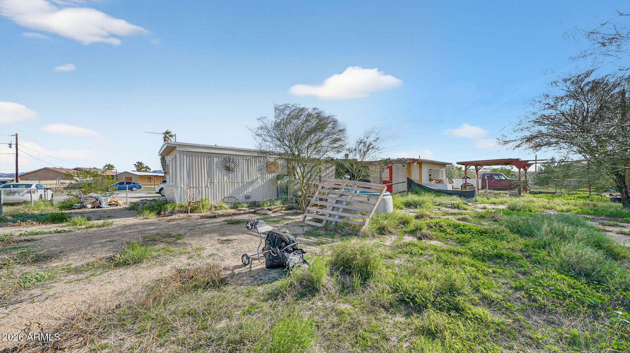 5675 Rocky Road Fort Mohave, AZ 86426 - Photo 11 of 30 a view of a house with a back yard