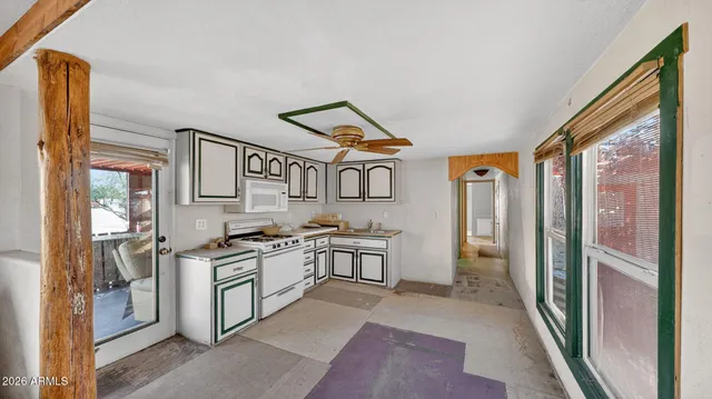 a kitchen with stainless steel appliances granite countertop a sink and cabinets