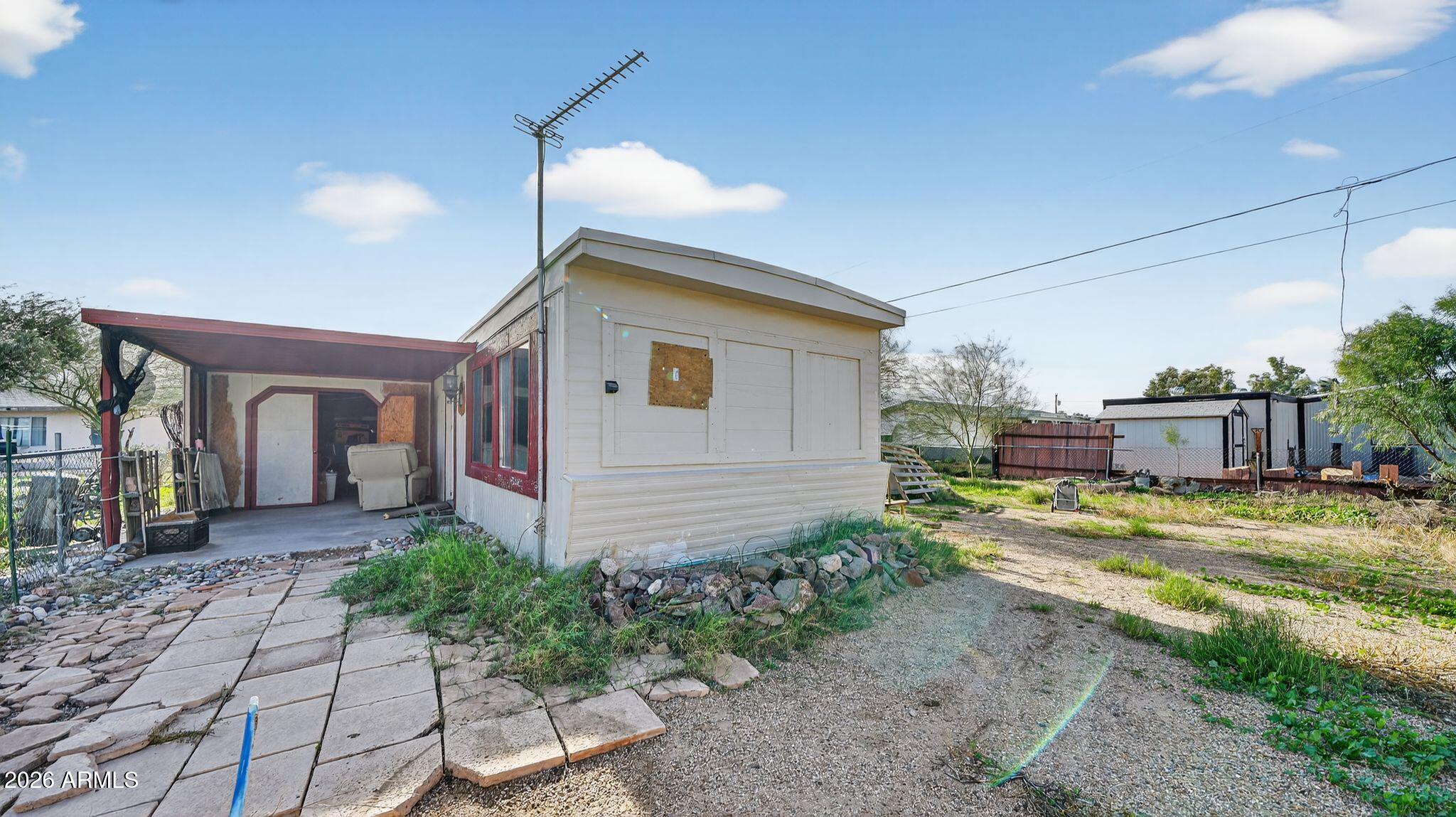 5675 Rocky Road Fort Mohave, AZ 86426 - Photo 3 of 30 a view of a house with backyard and sitting area