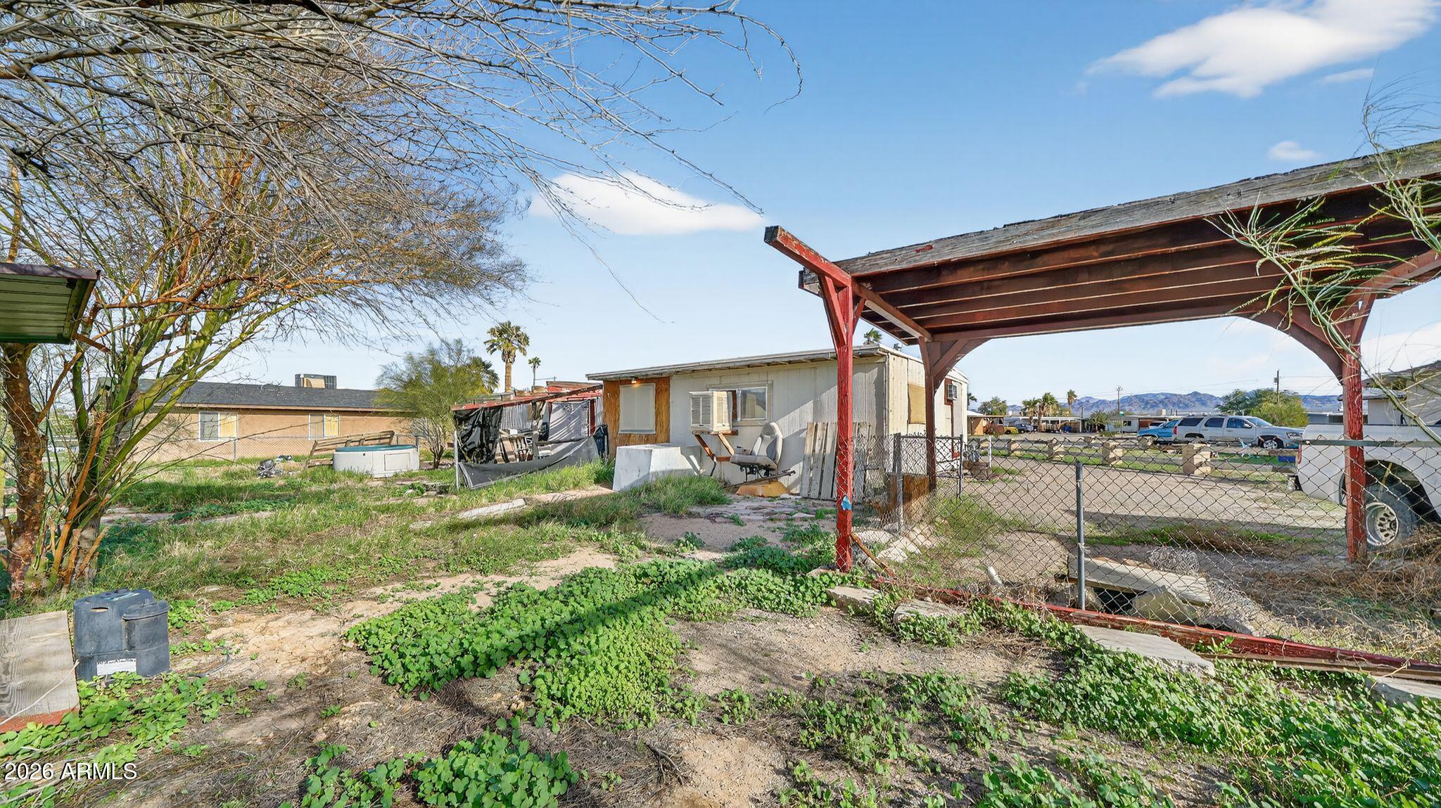 5675 Rocky Road Fort Mohave, AZ 86426 - Photo 5 of 30 a backyard of a house with a garden and outdoor seating