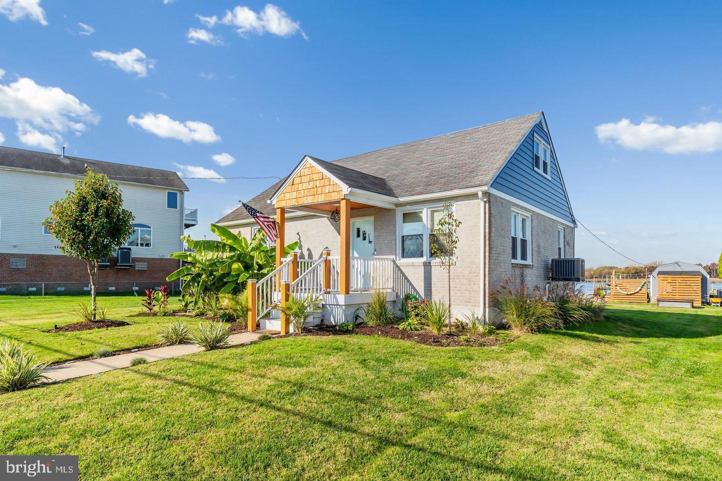 6934 River Drive Road Sparrows Point, MD 21219 - Photo 1 of 47 a view of a house with backyard and plants