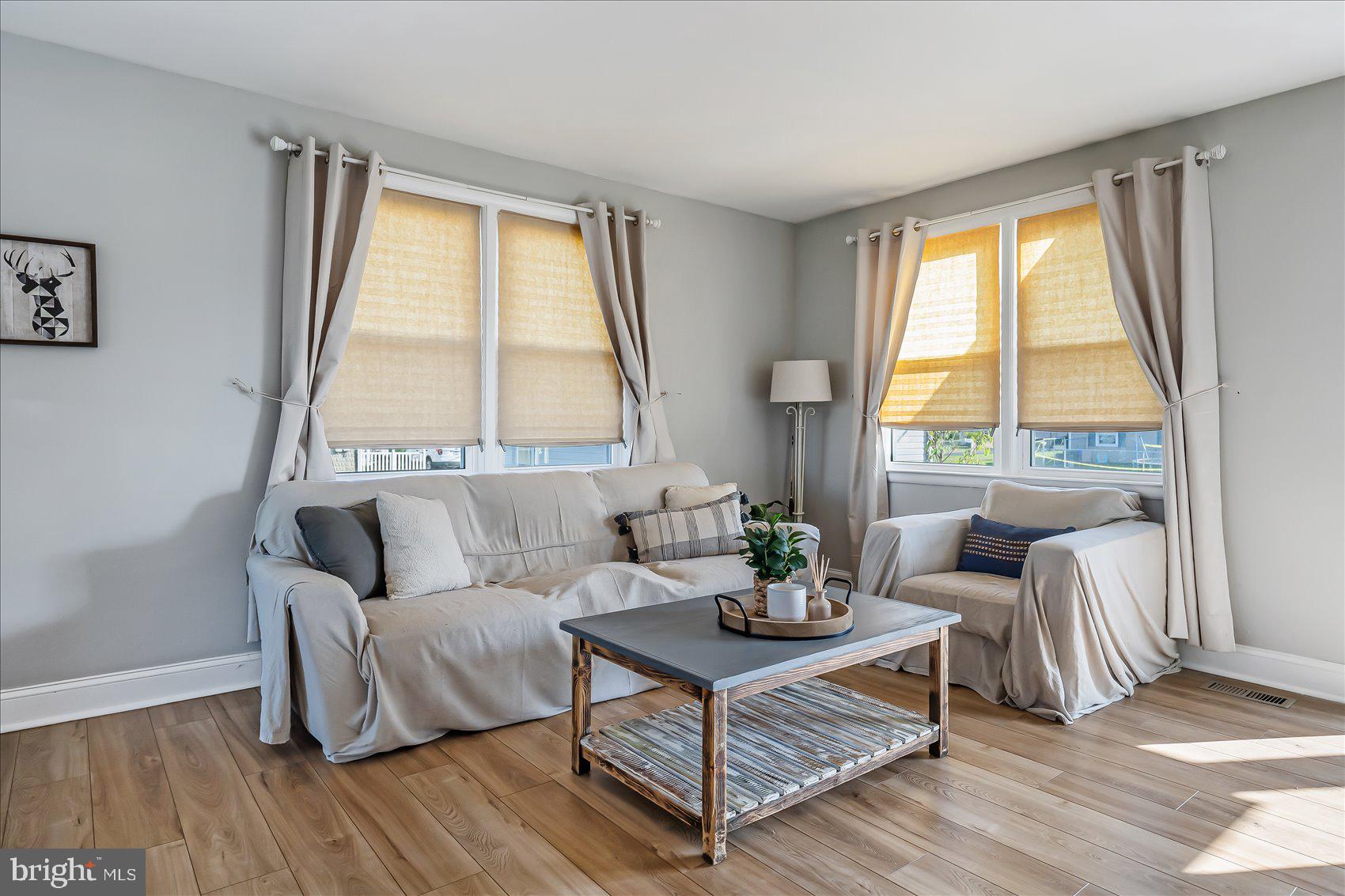 6934 River Drive Road Sparrows Point, MD 21219 - Photo 12 of 47 a living room with furniture and a window