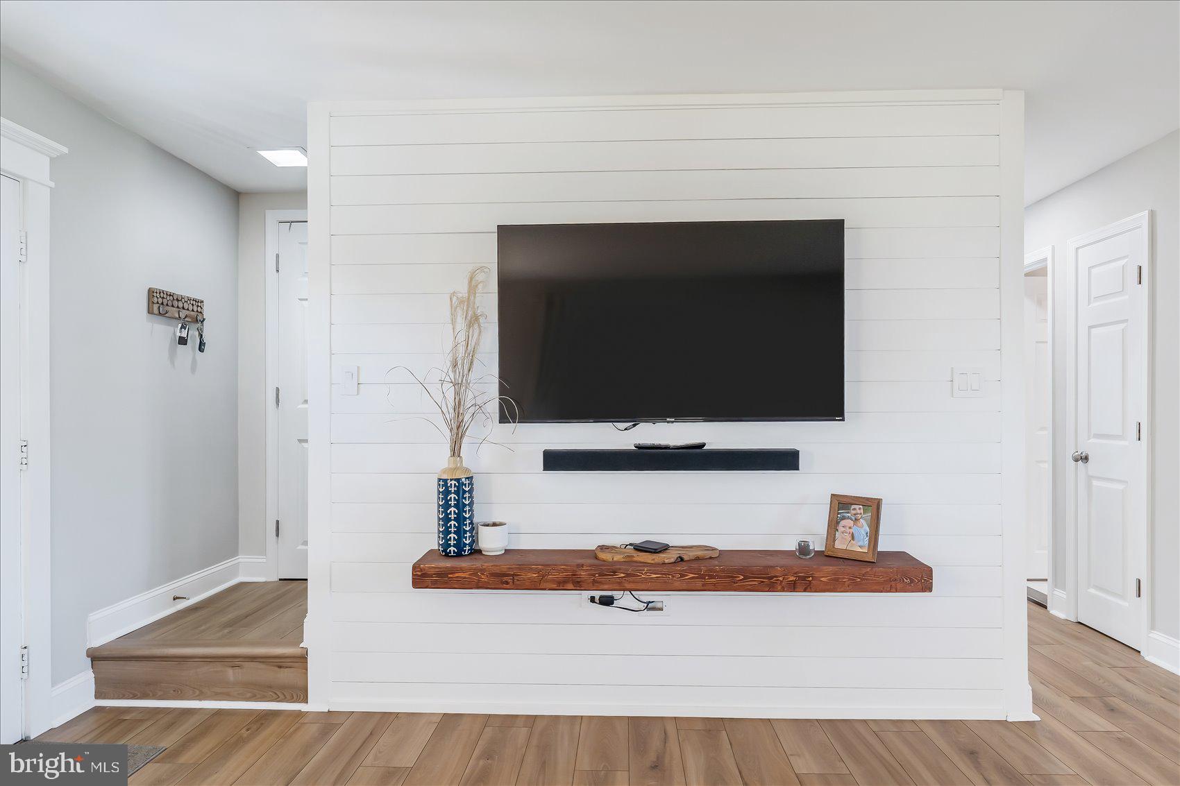 6934 River Drive Road Sparrows Point, MD 21219 - Photo 17 of 47 a living room with flat screen tv and a rug