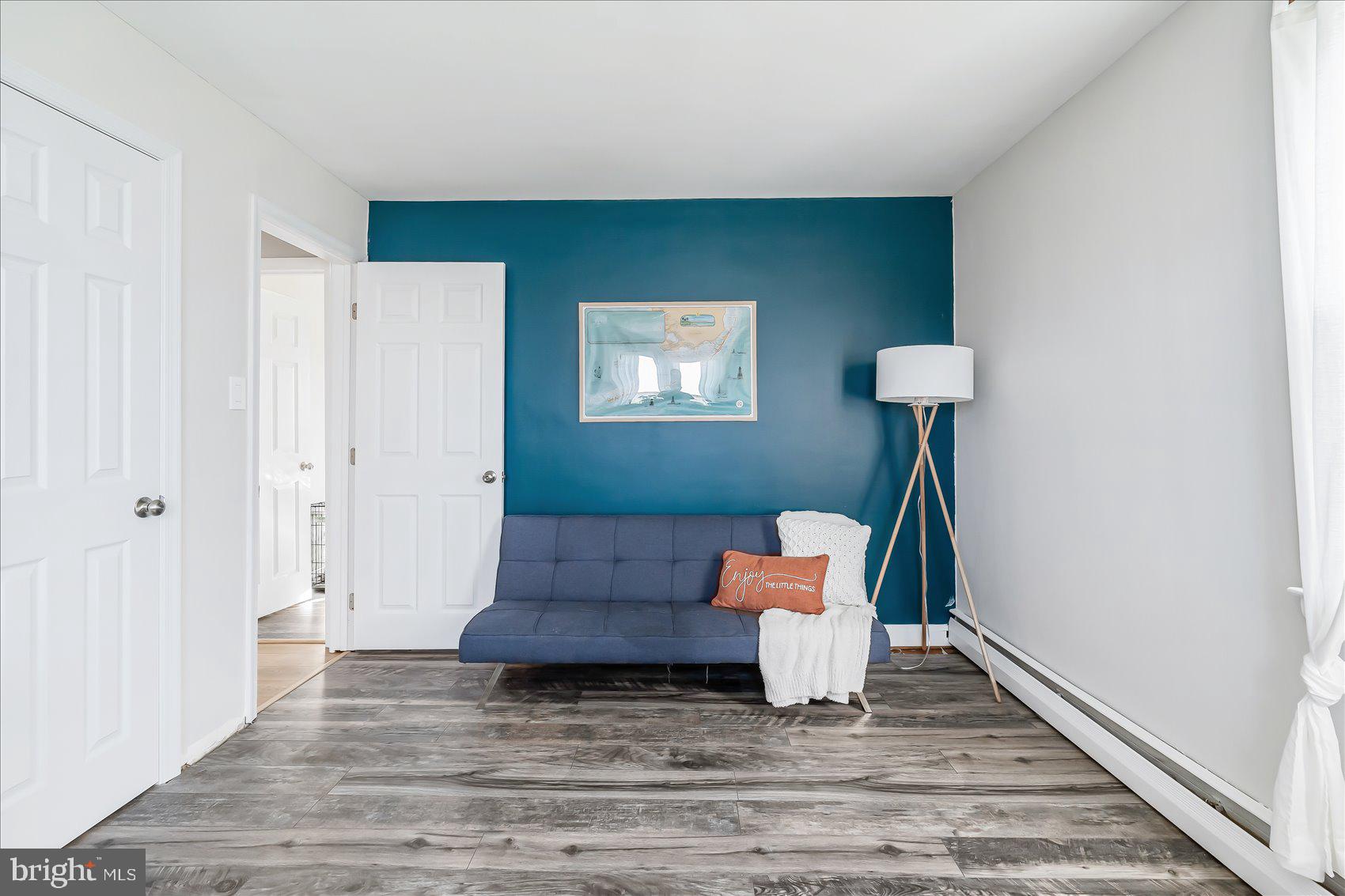 6934 River Drive Road Sparrows Point, MD 21219 - Photo 20 of 47 a living room with furniture and a wooden floor