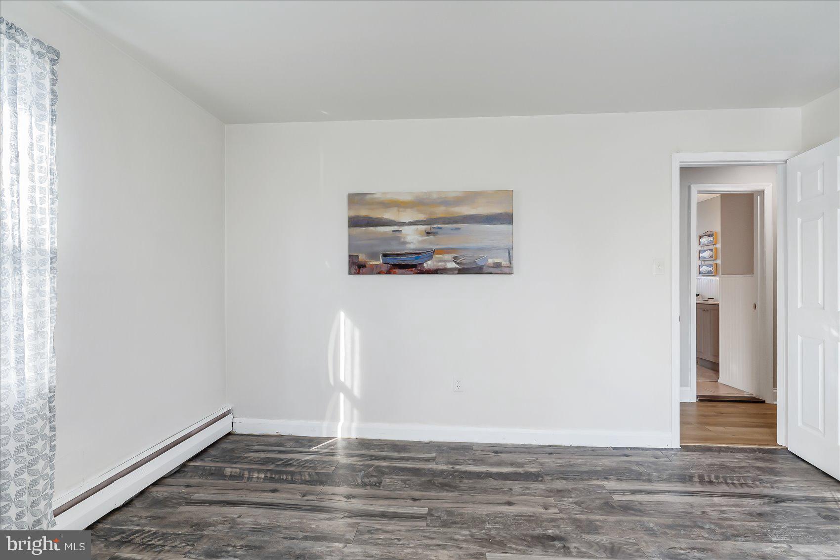 6934 River Drive Road Sparrows Point, MD 21219 - Photo 22 of 47 a view of a room with wooden floor