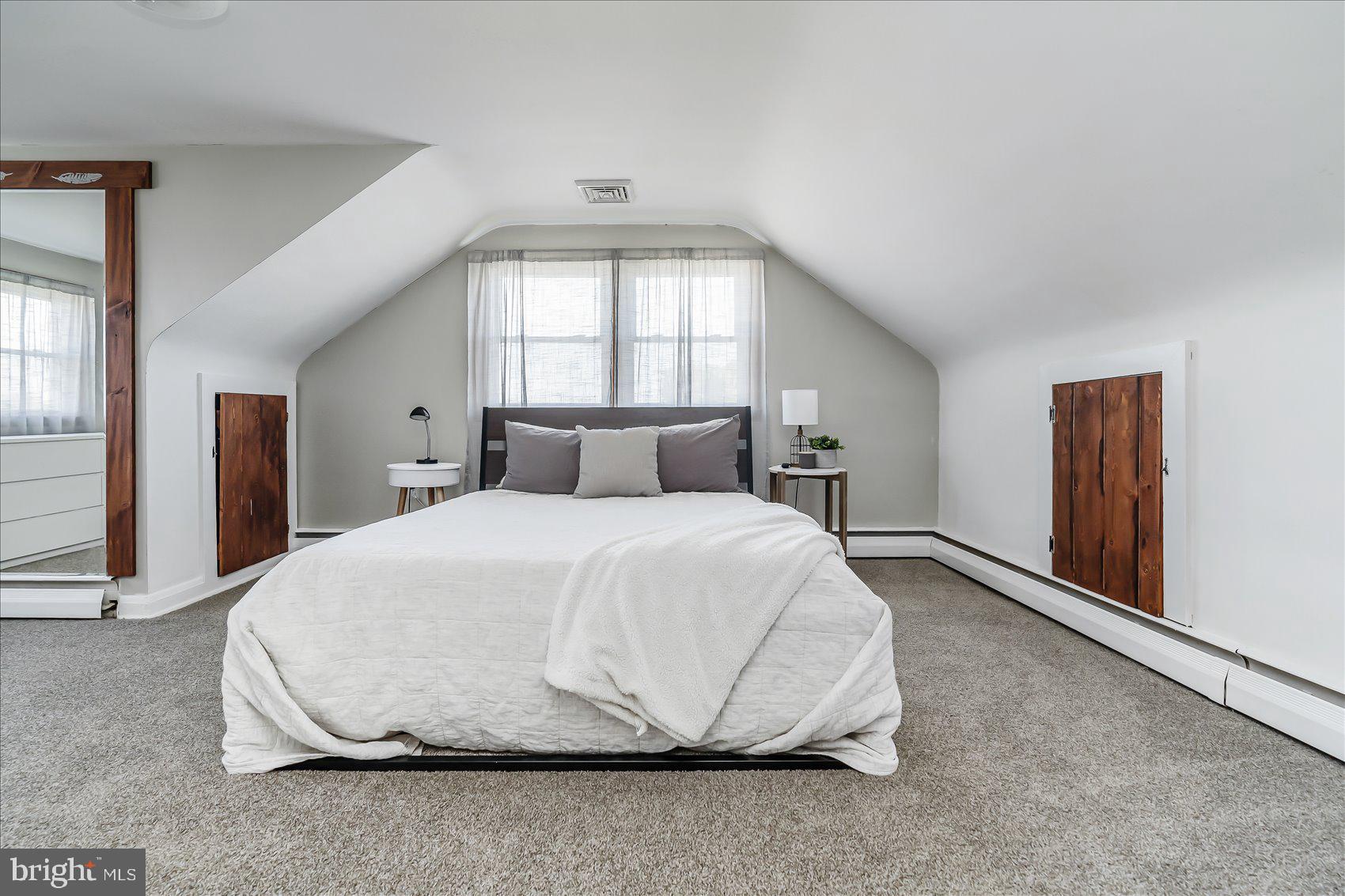 6934 River Drive Road Sparrows Point, MD 21219 - Photo 25 of 47 a bedroom with a bed and a window