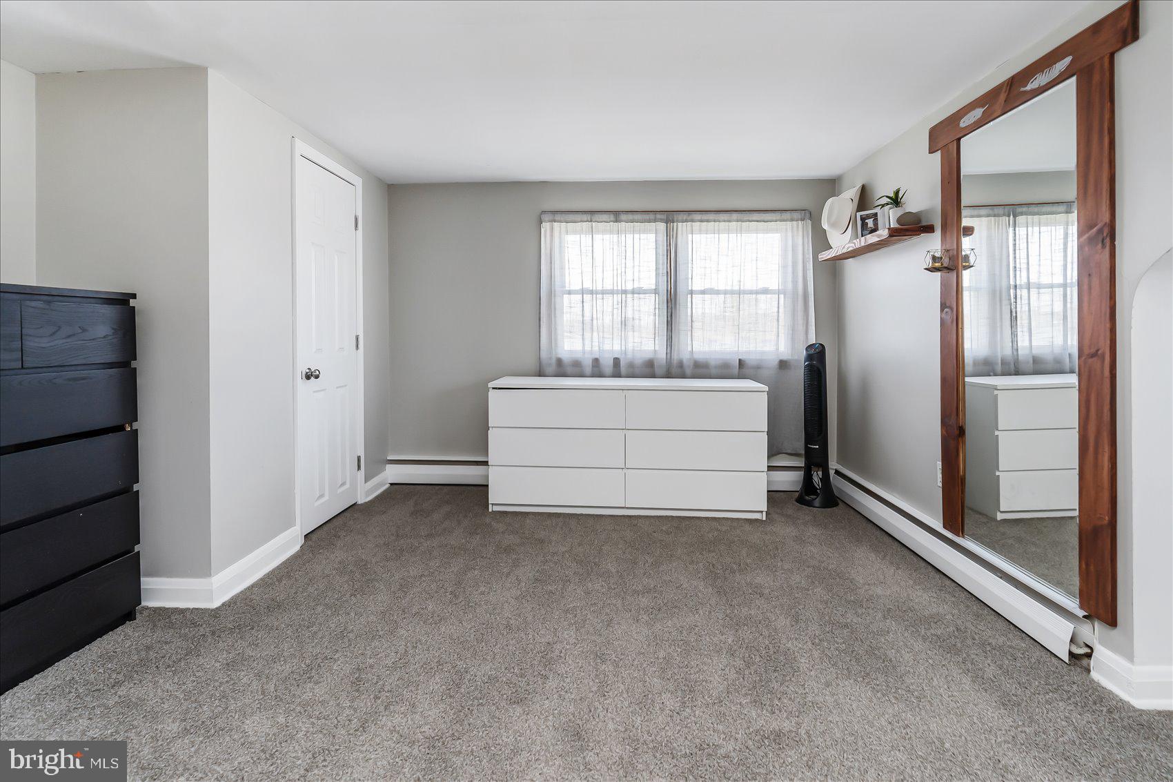 6934 River Drive Road Sparrows Point, MD 21219 - Photo 26 of 47 an empty room with windows and cabinet
