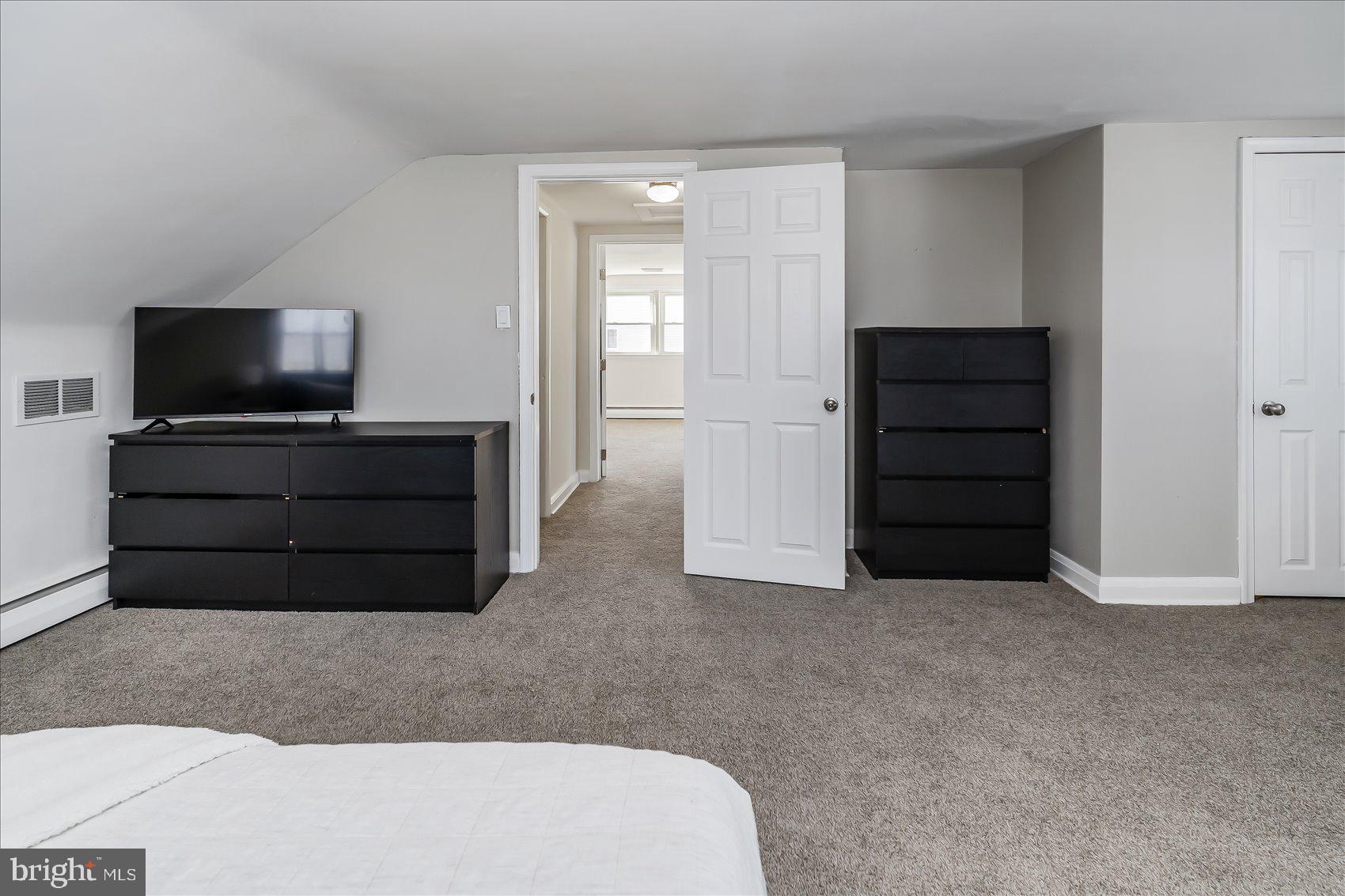 6934 River Drive Road Sparrows Point, MD 21219 - Photo 27 of 47 a living room with furniture and flat screen tv
