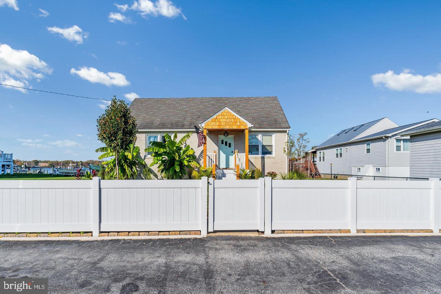 6934 River Drive Road Sparrows Point, MD 21219 - Photo 3 of 47 a view of a house with a yard