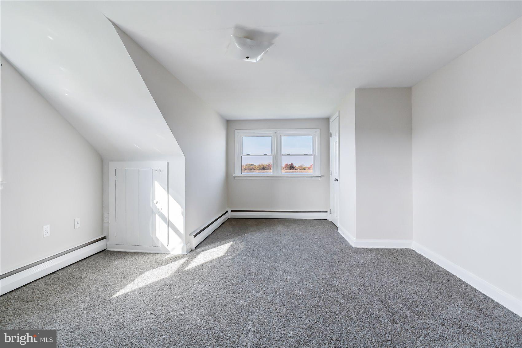 6934 River Drive Road Sparrows Point, MD 21219 - Photo 31 of 47 an empty room with white walls and windows