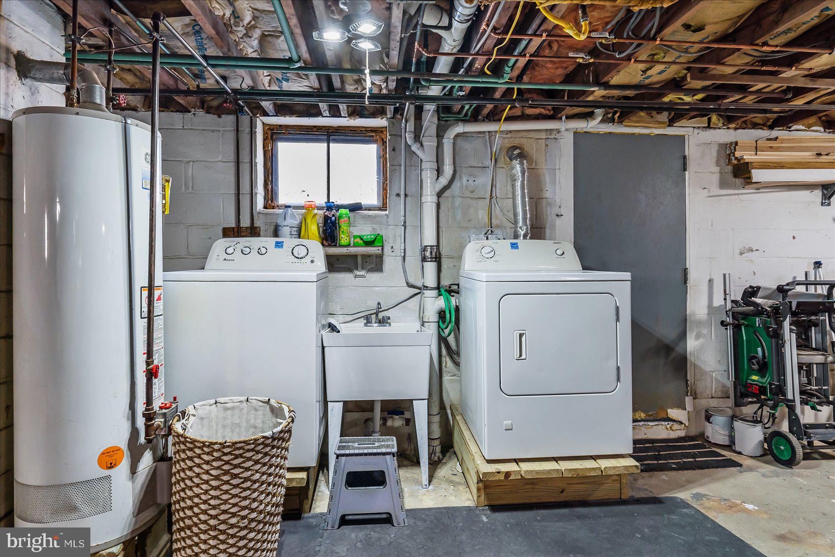 6934 River Drive Road Sparrows Point, MD 21219 - Photo 37 of 47 a utility room with dryer and washer