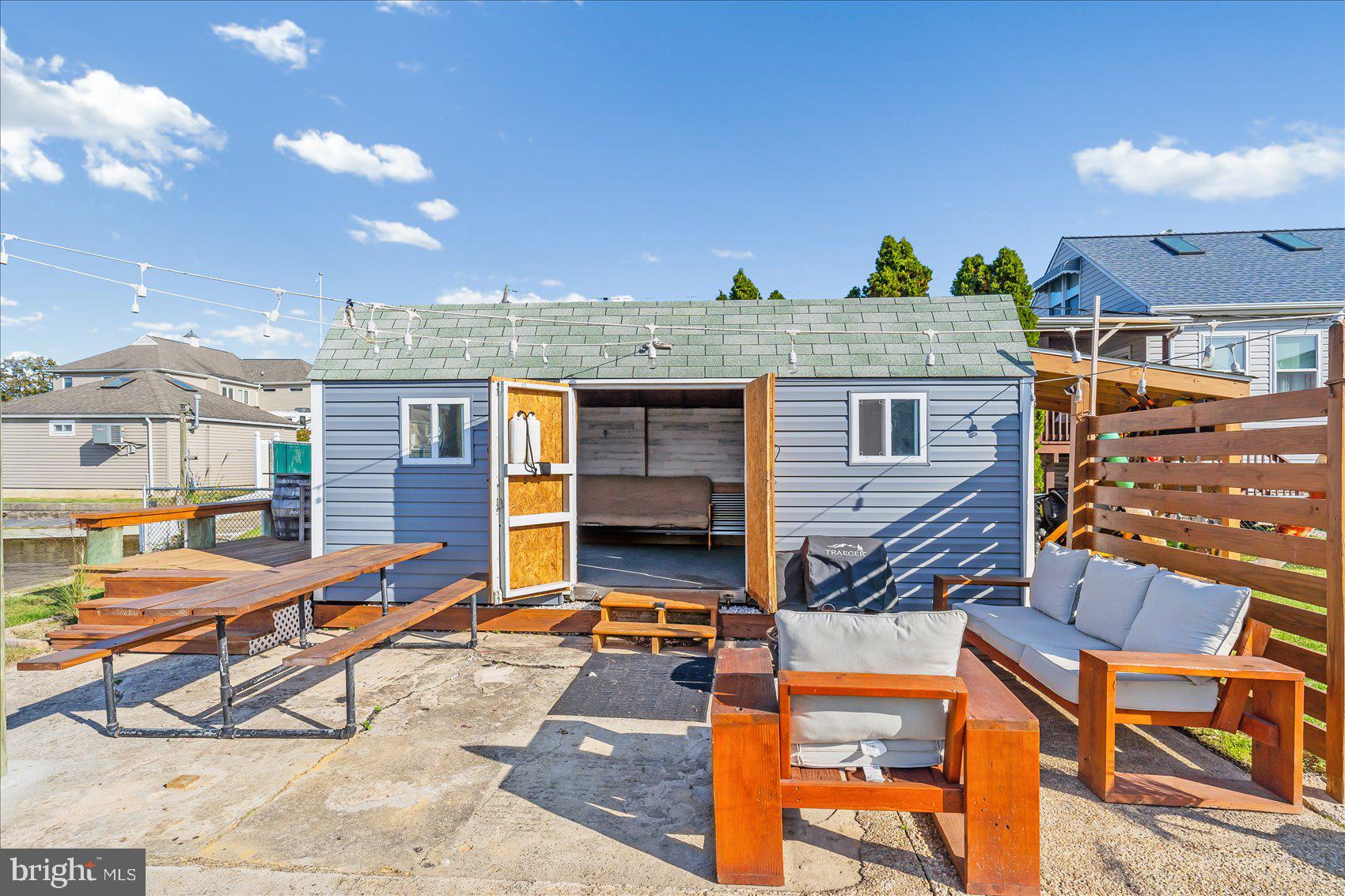 6934 River Drive Road Sparrows Point, MD 21219 - Photo 40 of 47 a view of a chairs and table in the patio