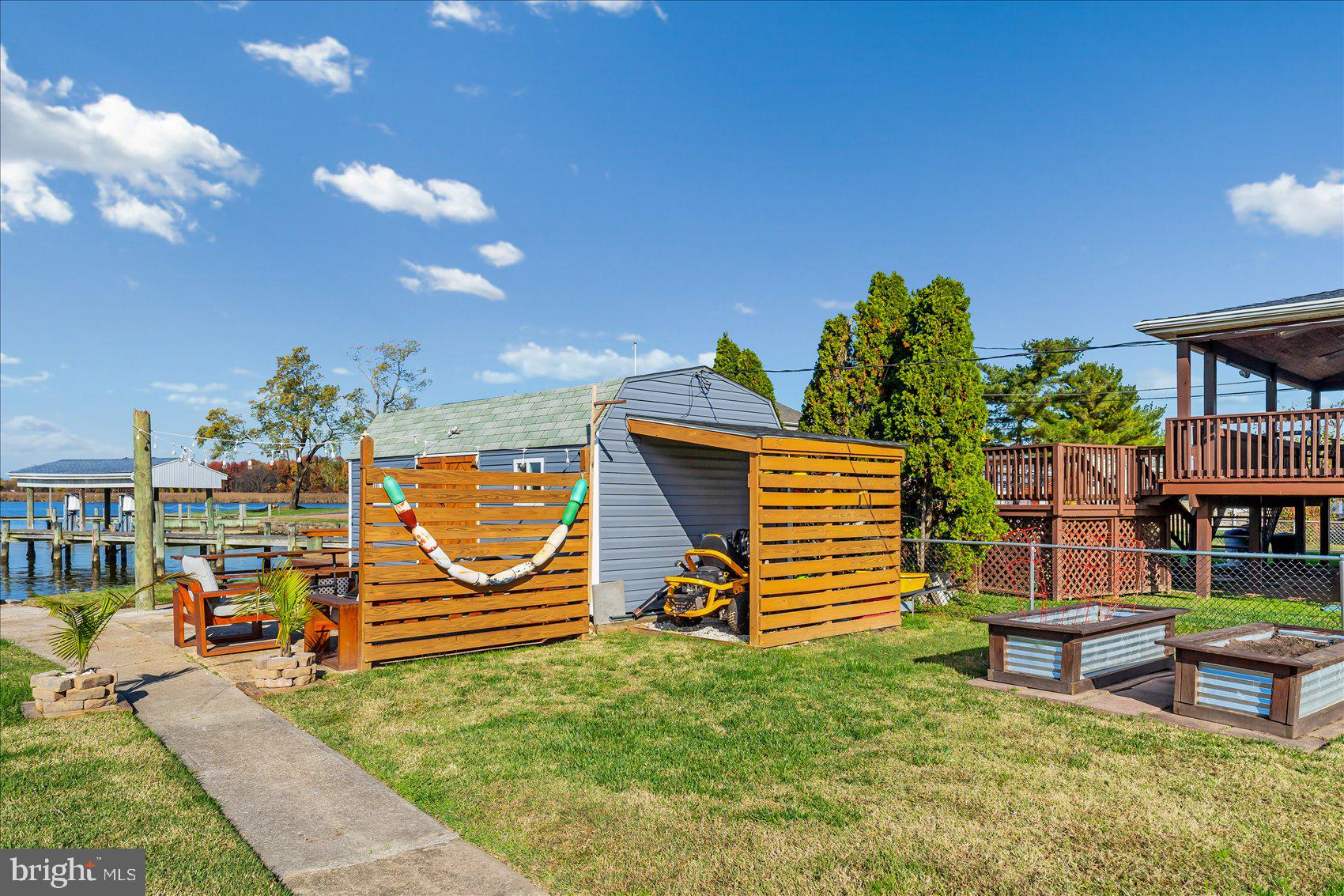 6934 River Drive Road Sparrows Point, MD 21219 - Photo 42 of 47 a view of a chairs and table in the patio