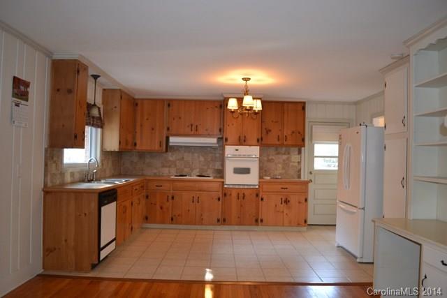 3421 Pinehill Road Rock Hill, SC 29732 - Photo 5 of 14 a view of a kitchen with a sink and dishwasher a refrigerator with wooden floor