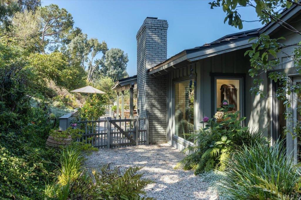 5125 El Secreto Rancho Santa Fe, CA 92067 - Photo 26 of 35 a front view of a house with a yard