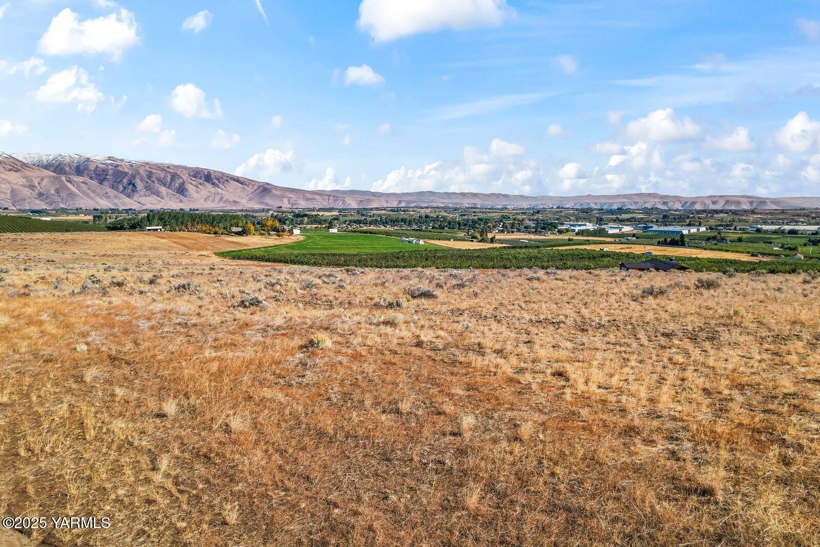 a view of a lake with houses in the back