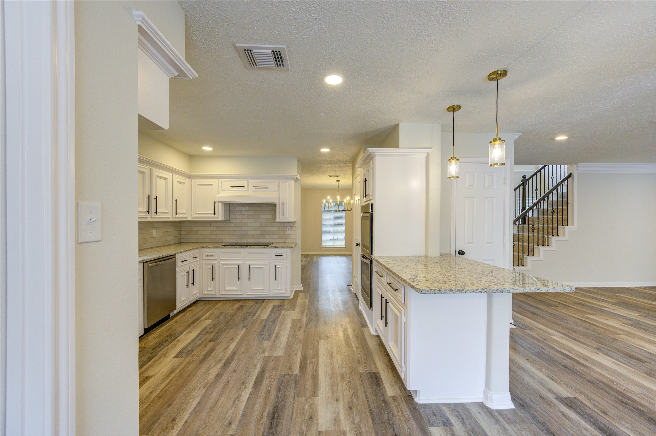 12015 Laneview Drive Houston, TX 77070 - Photo 12 of 40 a large kitchen with a large counter top space a sink stainless steel appliances and cabinets