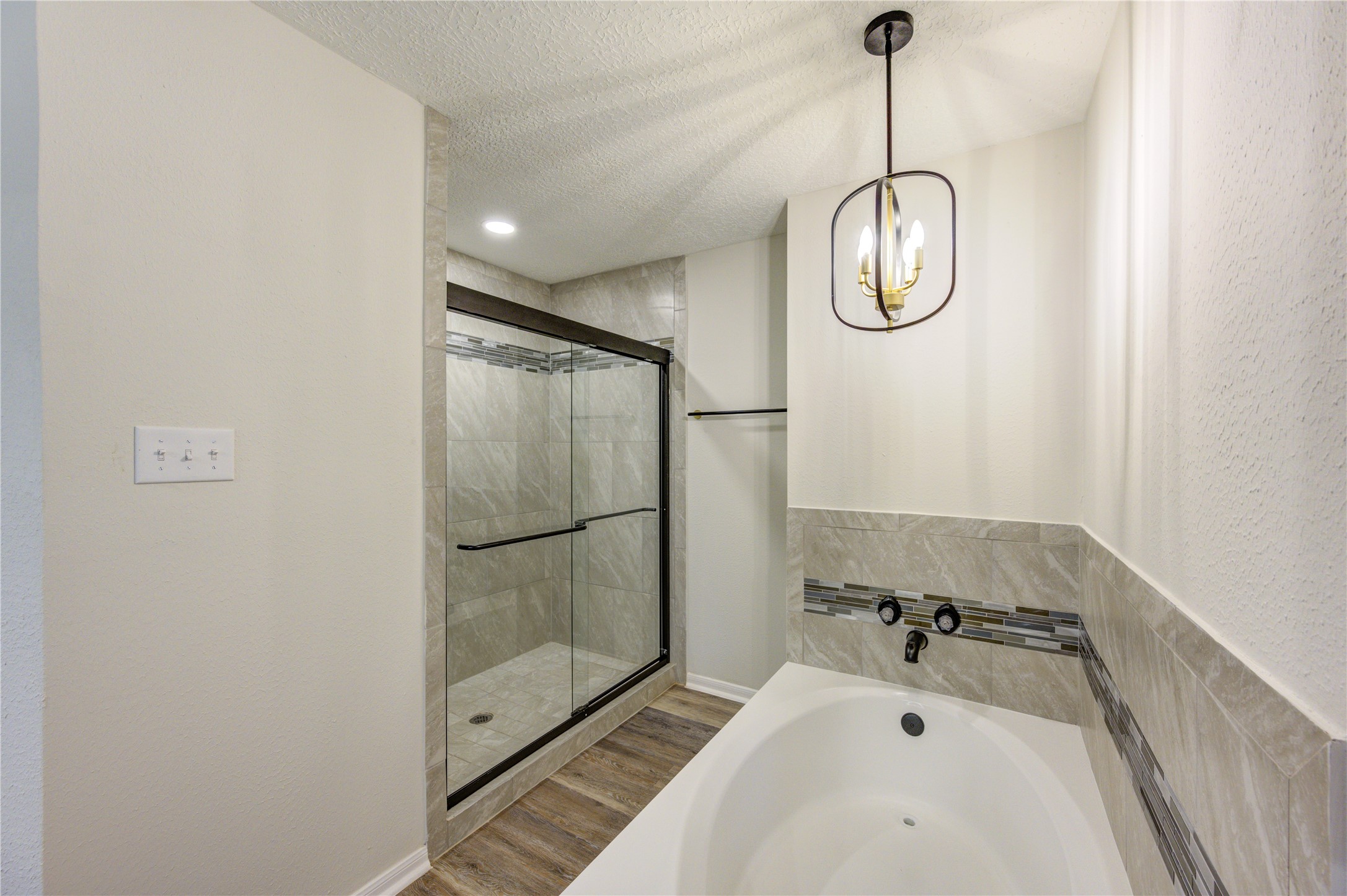 12015 Laneview Drive Houston, TX 77070 - Photo 19 of 40 a bathroom with a tub and a shower
