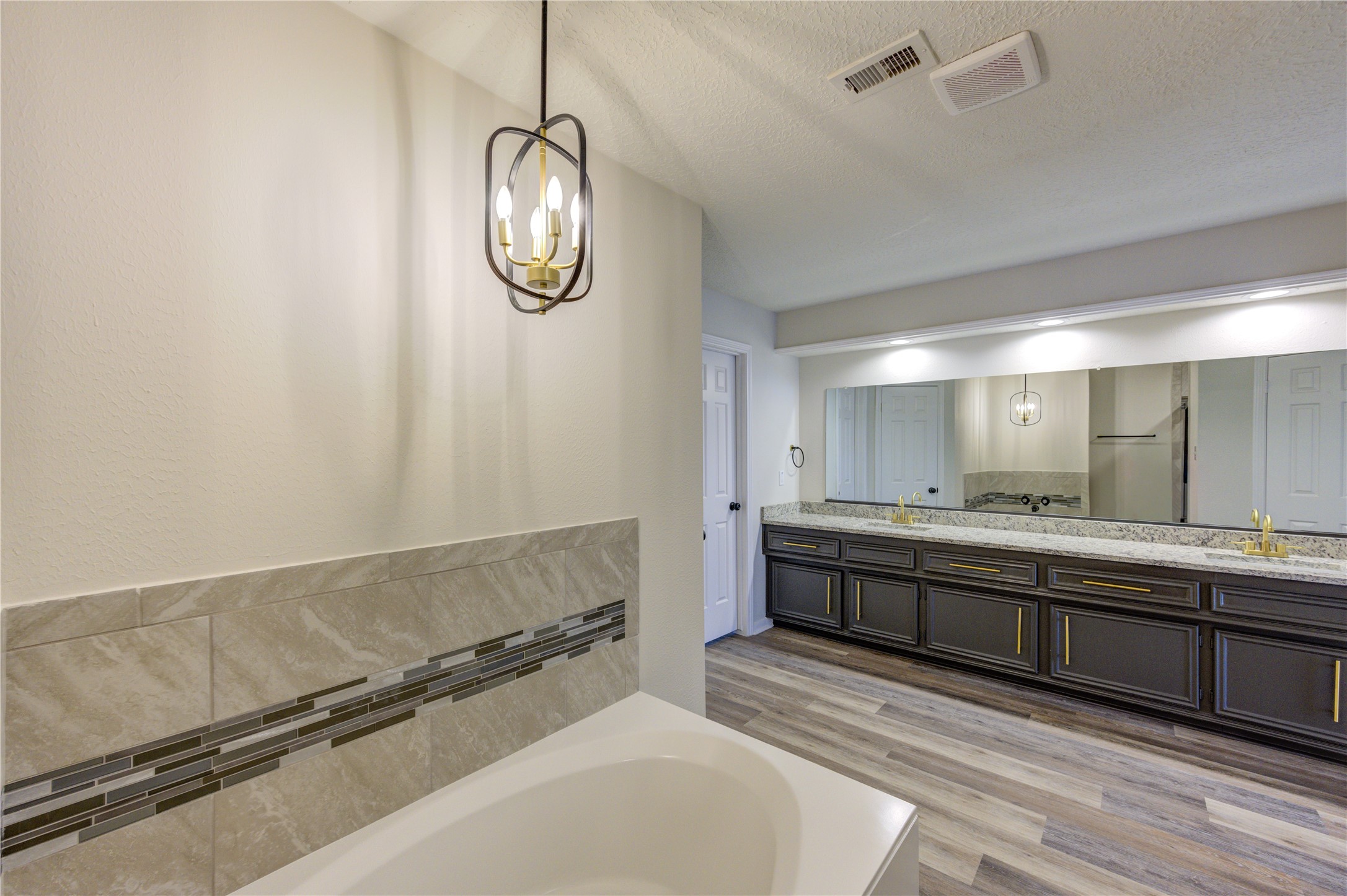 12015 Laneview Drive Houston, TX 77070 - Photo 20 of 40 a spacious bathroom with a sink and a mirror