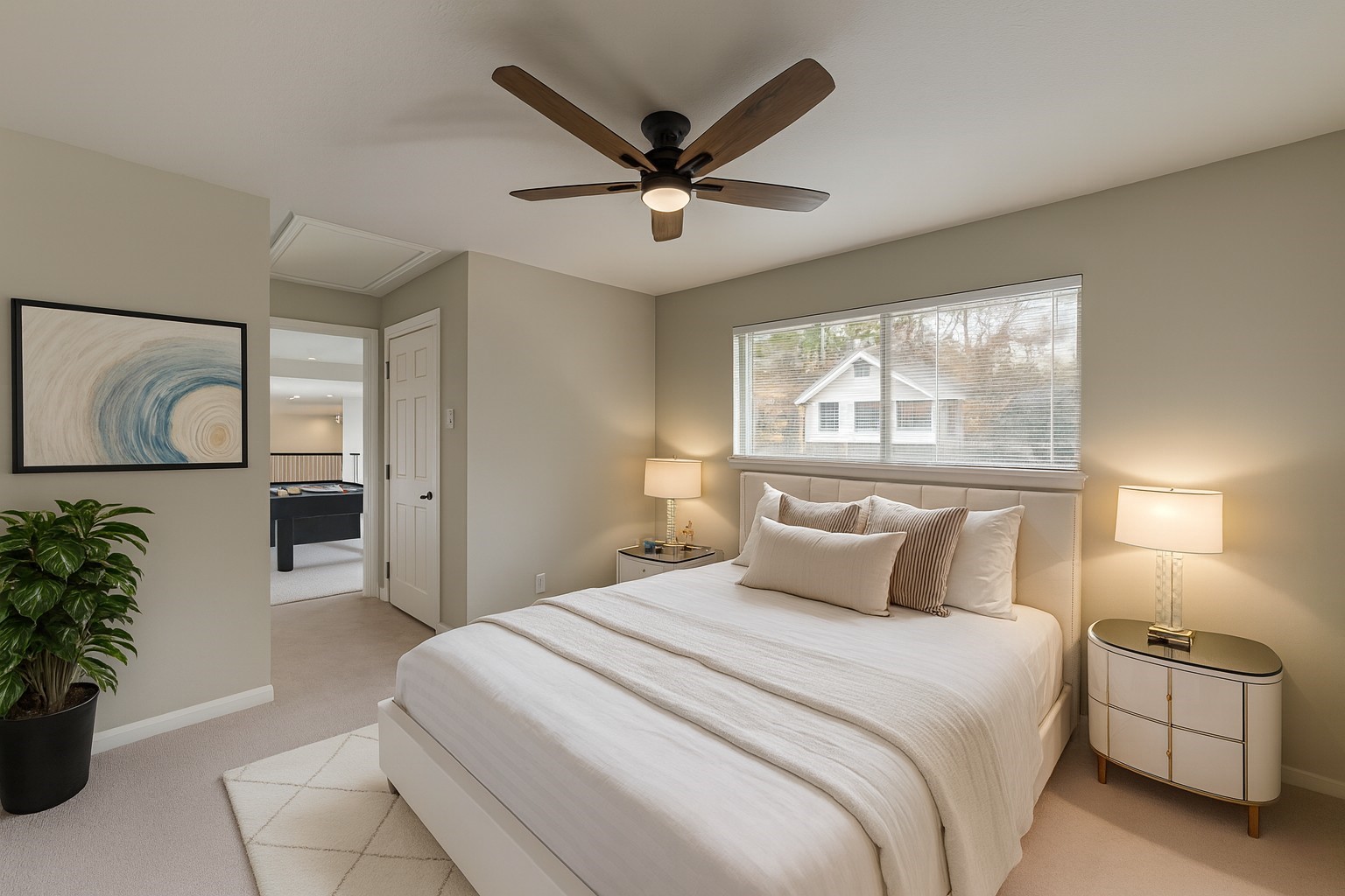 12015 Laneview Drive Houston, TX 77070 - Photo 29 of 40 a bedroom with a large bed and a chandelier