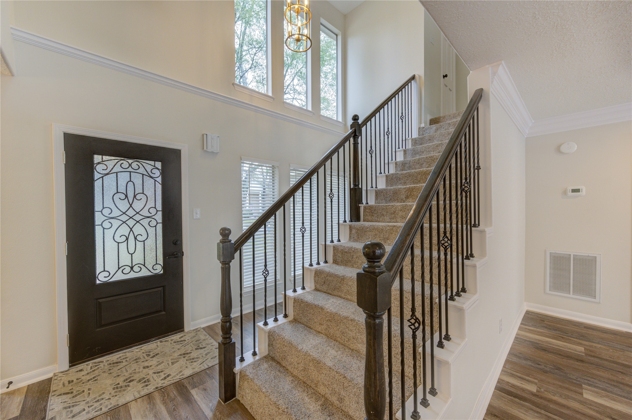 12015 Laneview Drive Houston, TX 77070 - Photo 4 of 40 a view of entryway and hall with wooden floor