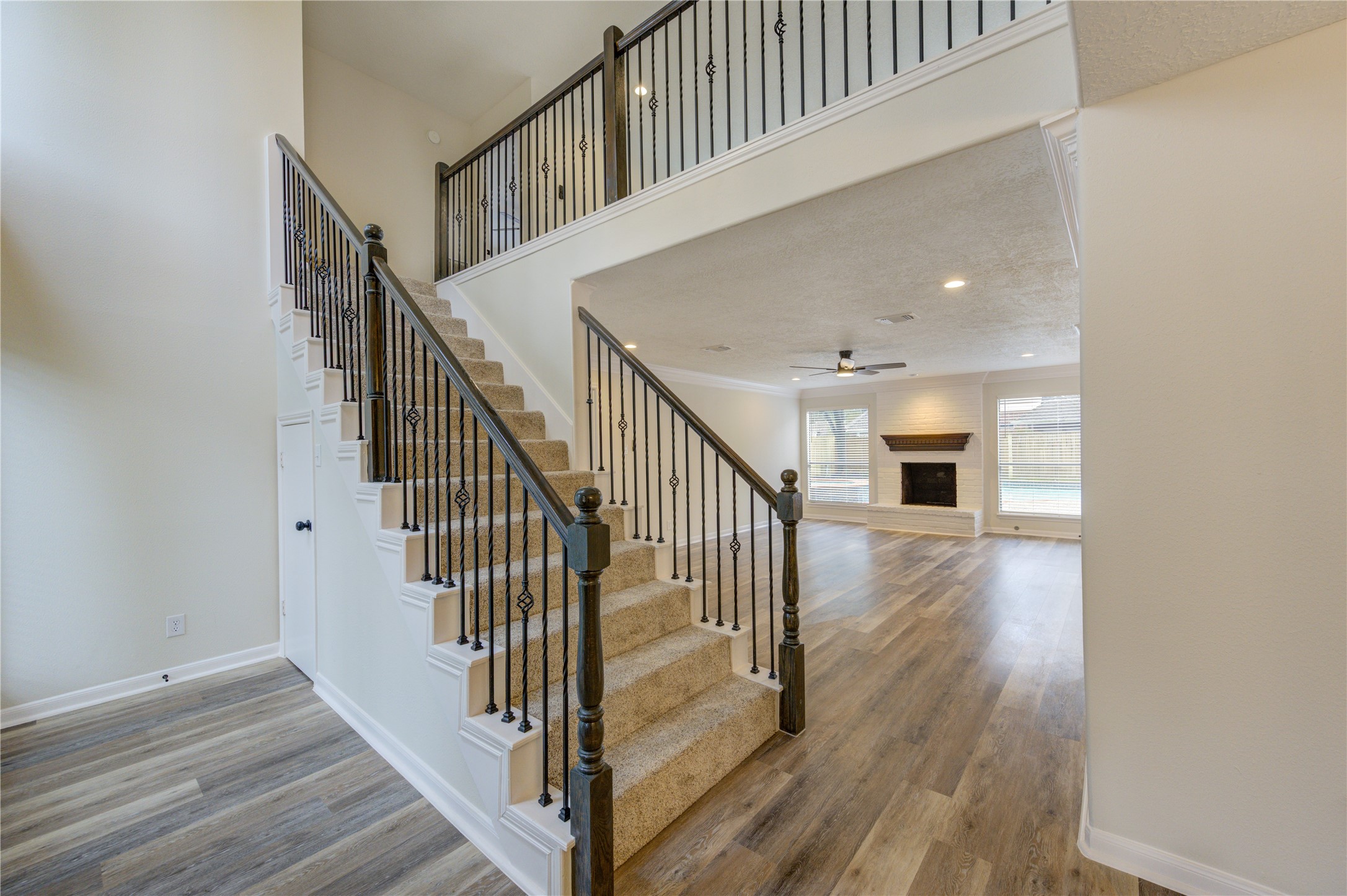 12015 Laneview Drive Houston, TX 77070 - Photo 5 of 40 a view of staircase with wooden floor and a rug
