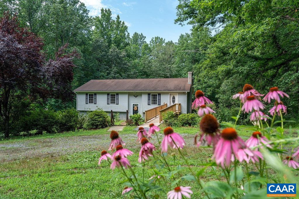 4965 Celt Road Stanardsville, VA 22973 - Photo 1 of 55 a front view of house with yard and seating area