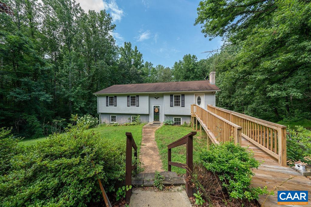 4965 Celt Road Stanardsville, VA 22973 - Photo 18 of 55 a view of house with a yard and potted plants