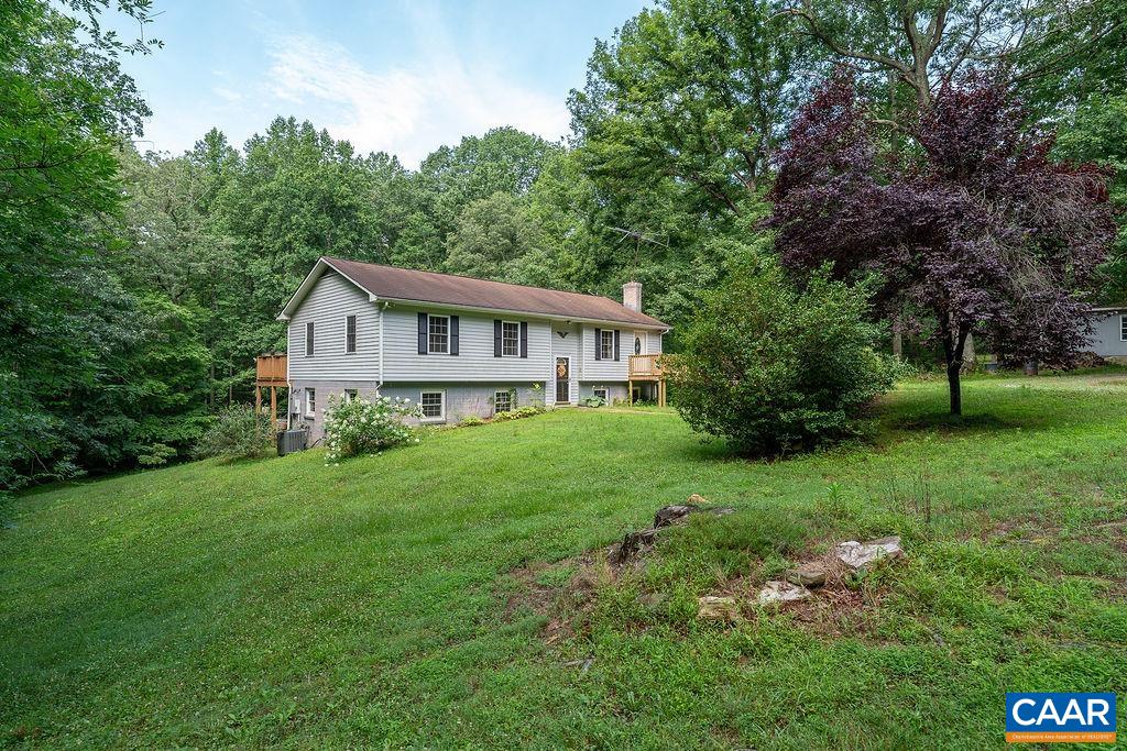 4965 Celt Road Stanardsville, VA 22973 - Photo 2 of 55 a view of a house with backyard and garden