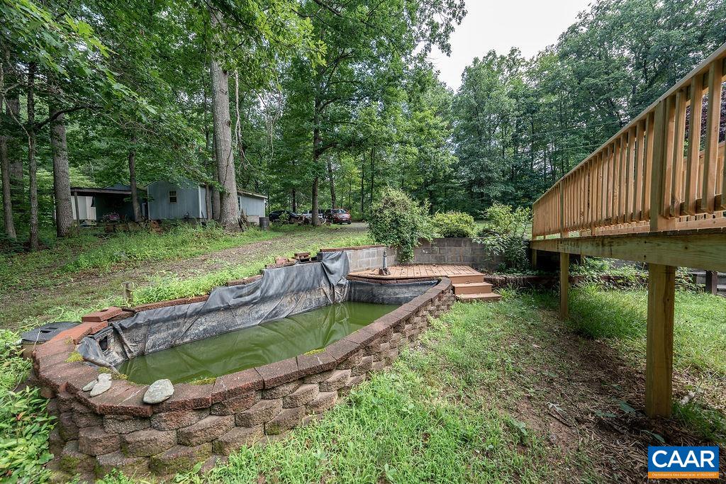 4965 Celt Road Stanardsville, VA 22973 - Photo 23 of 55 a view of a backyard with plants and a patio