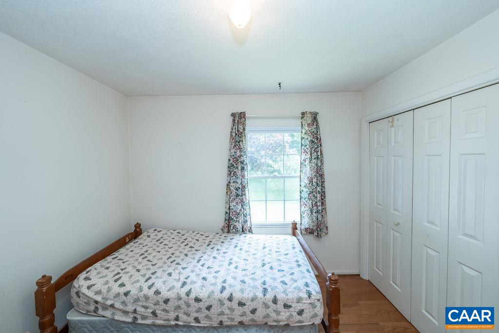 4965 Celt Road Stanardsville, VA 22973 - Photo 24 of 55 a bedroom with a bed and a window
