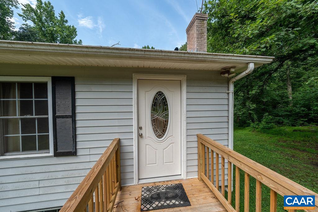 4965 Celt Road Stanardsville, VA 22973 - Photo 26 of 55 a front view of a house with garden