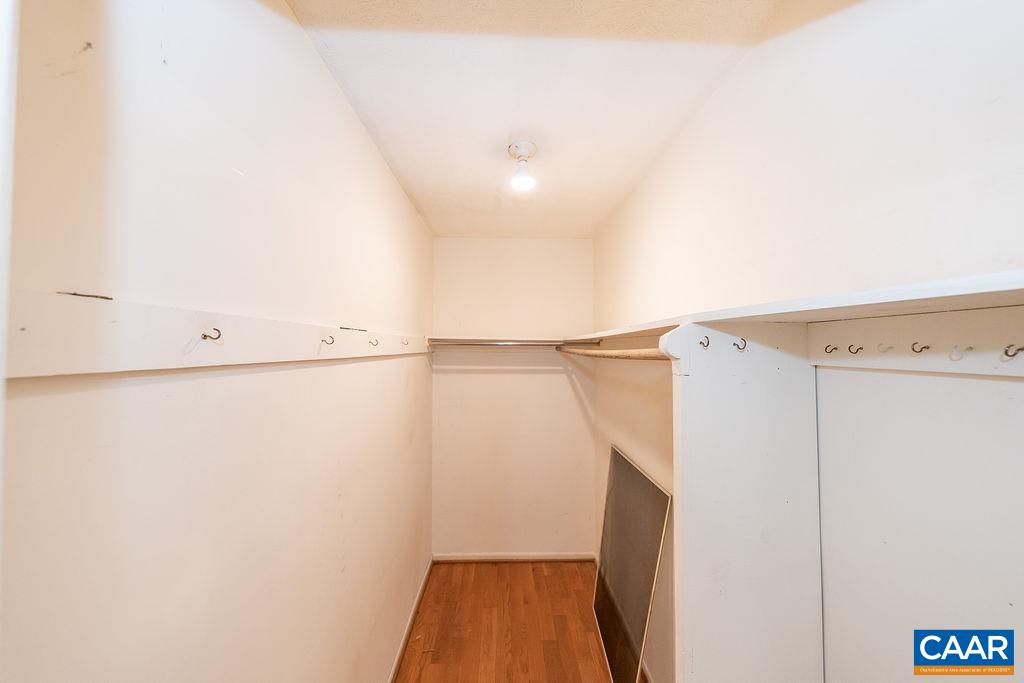 4965 Celt Road Stanardsville, VA 22973 - Photo 34 of 55 a view of walk in closet with empty racks