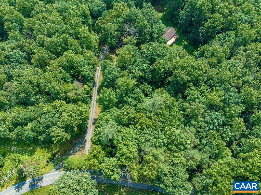 4965 Celt Road Stanardsville, VA 22973 - Photo 46 of 55 an aerial view of residential house with outdoor space and trees all around