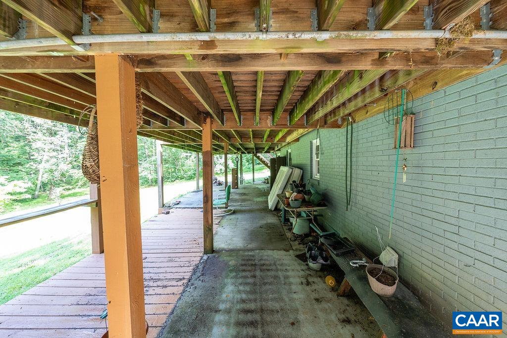4965 Celt Road Stanardsville, VA 22973 - Photo 47 of 55 a view of a porch with wooden floor in front of building