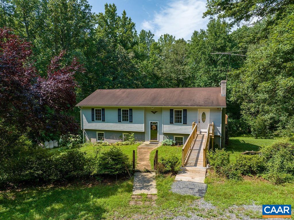 4965 Celt Road Stanardsville, VA 22973 - Photo 49 of 55 a backyard of a house with table and chairs