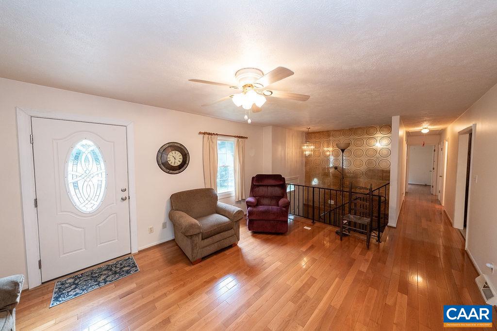4965 Celt Road Stanardsville, VA 22973 - Photo 5 of 55 a living room with furniture and a wooden floor