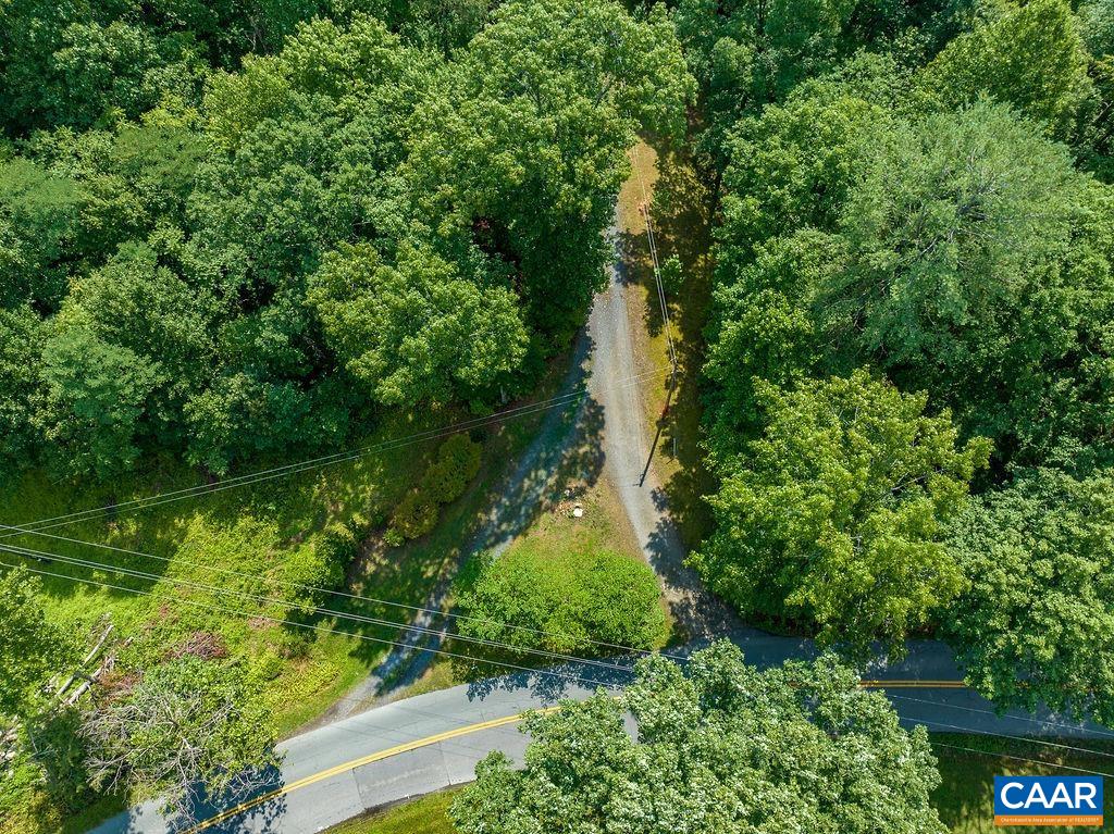 4965 Celt Road Stanardsville, VA 22973 - Photo 54 of 55 a view of a garden with a lake