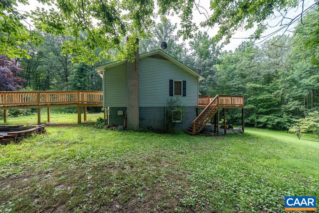 4965 Celt Road Stanardsville, VA 22973 - Photo 6 of 55 a view of a house with backyard and a tree
