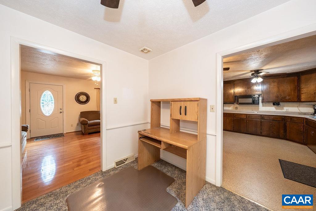 4965 Celt Road Stanardsville, VA 22973 - Photo 10 of 55 a kitchen with stainless steel appliances kitchen island granite countertop a refrigerator and a sink