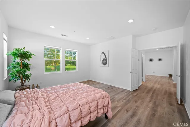 a bedroom with a bed and a mirror