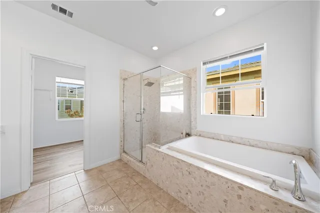 a large bathroom with a double vanity sink and a mirror