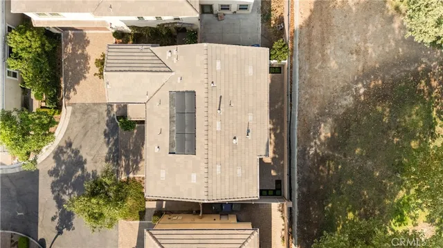 a view of a white house with large windows