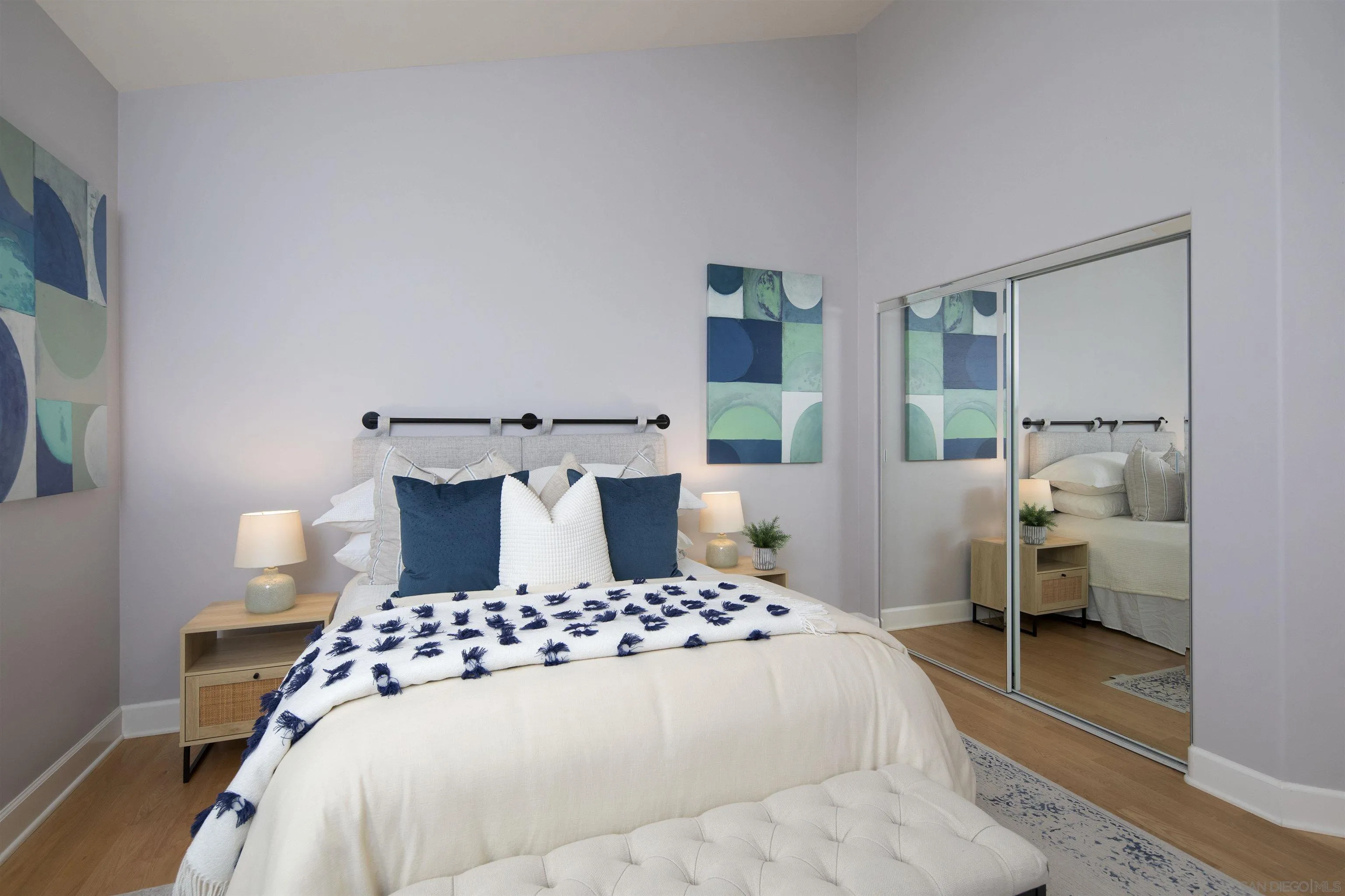 145 3rd Street Encinitas, CA 92024 - Photo 13 of 34 a bedroom with a bed and wooden floor