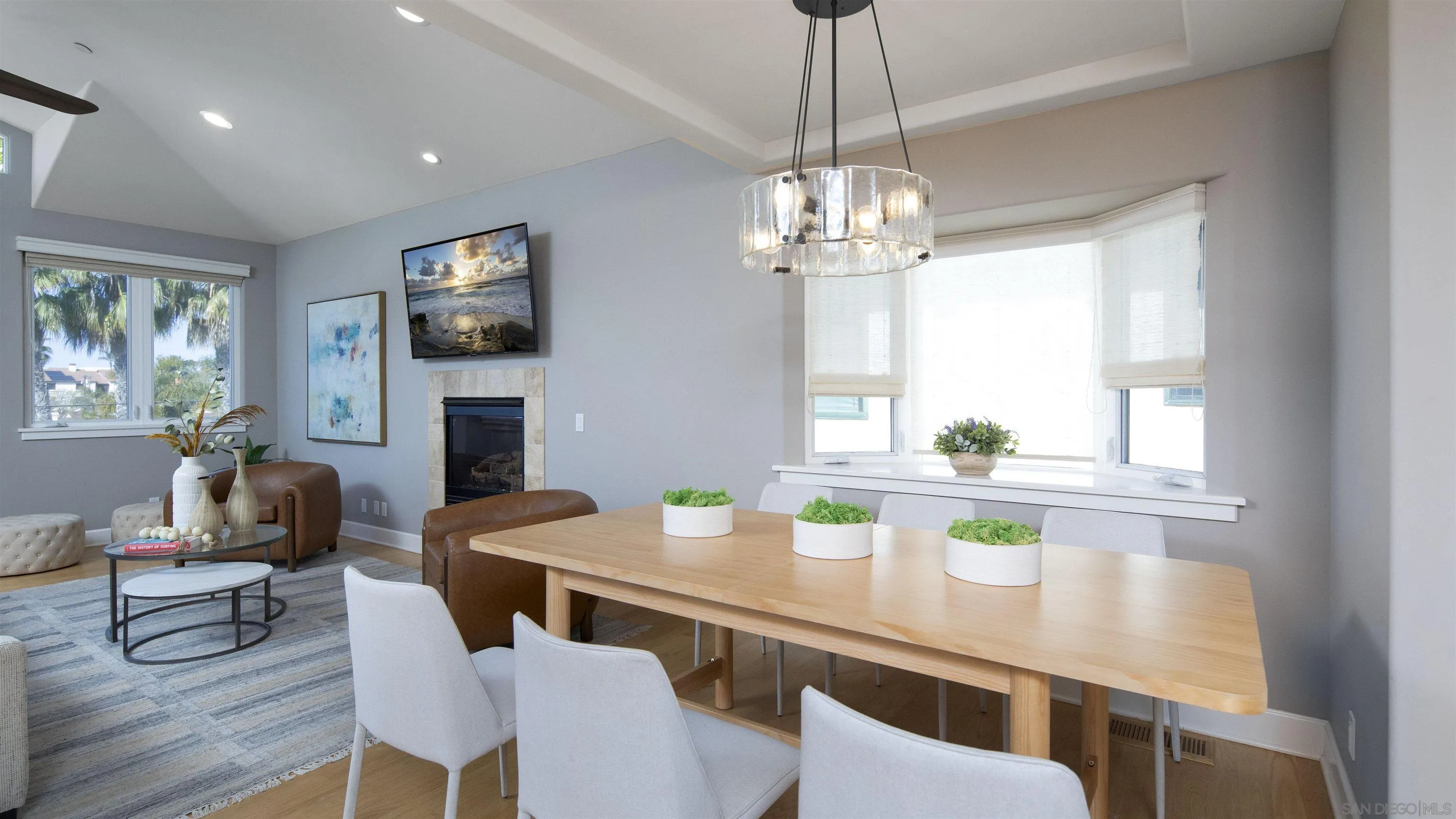 145 3rd Street Encinitas, CA 92024 - Photo 17 of 34 a view of a dining room with furniture a chandelier and wooden floor