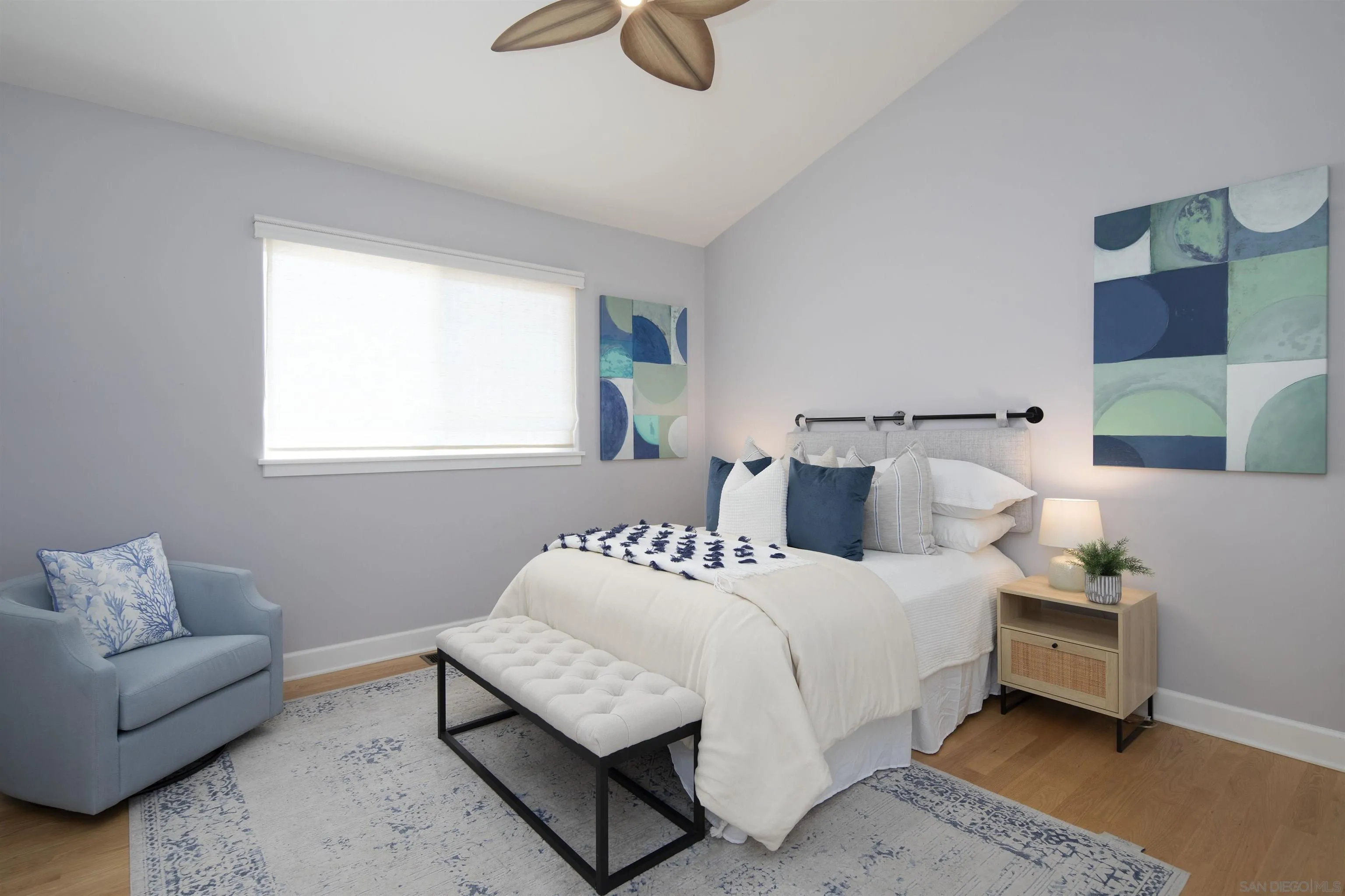 145 3rd Street Encinitas, CA 92024 - Photo 18 of 34 a bedroom with bed and window