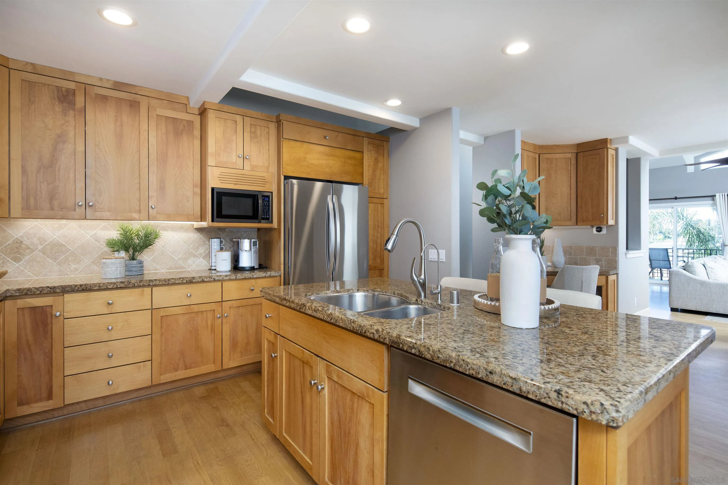 145 3rd Street Encinitas, CA 92024 - Photo 21 of 34 a kitchen with stainless steel appliances granite countertop sink stove and refrigerator